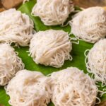 Rice idiyappams served on banana leaf in a plate