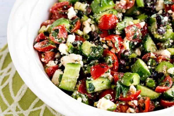 Tomato Cucumber Salad with Mint and Feta in serving bowl