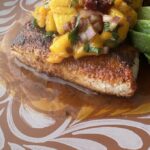 plated fish with mango salsa