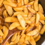 An overhead image of a skillet with fried apples.