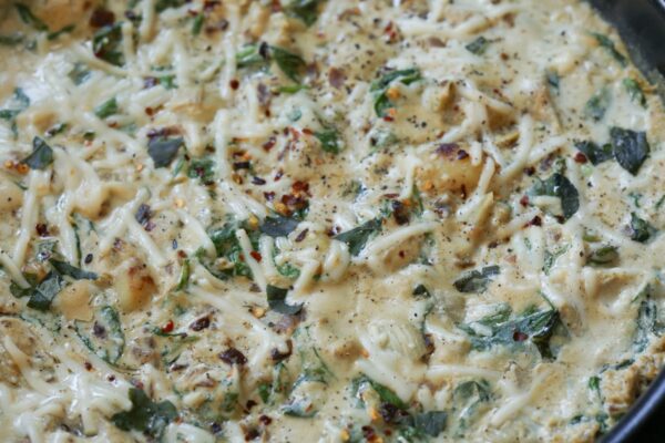 spinach artichoke gnocchi in the pan