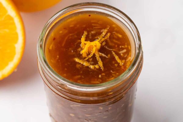 A jar of orange chicken sauce.