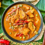 Gaeng panang gai served in a black bowl.