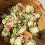 Herby Potato Salad in a wooden bowl