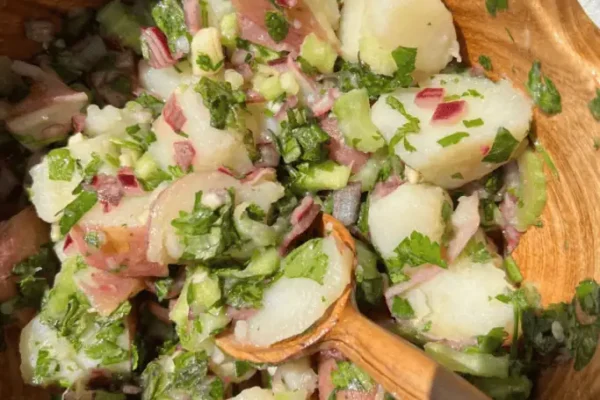 Herby Potato Salad in a wooden bowl