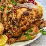 Jaj mahshi rice stuffed chicken on a platter