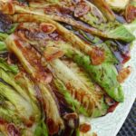 blanched lettuce with oyster sauce based seasoning and garlic.