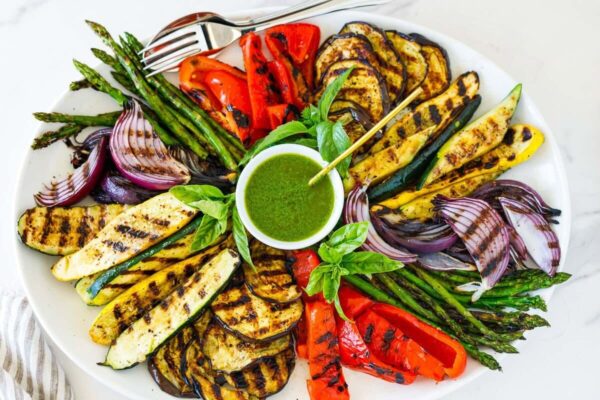 Learn how to make perfectly grilled vegetables with this easy, foolproof recipe. A healthy summer side dish, these smoky, flavorful veggies are caramelized to perfection every time. As a caterer, I’ve prepared this grilled vegetable recipe for hundreds of guests—and it never disappoints. Vegan + gluten-free.