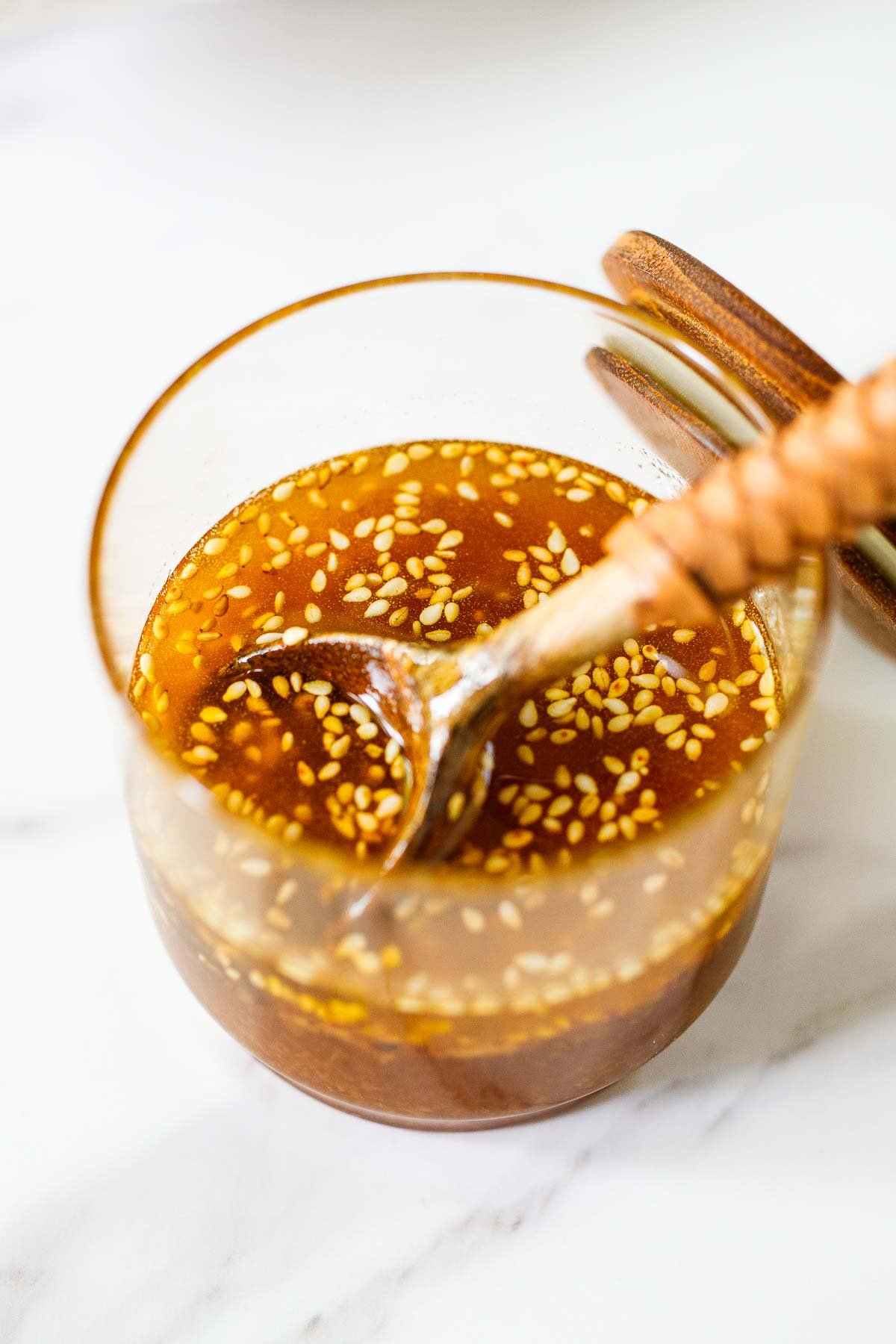 This refreshing bok choy salad is tossed in a sweet and tangy sesame ginger dressing, topped with crunchy sesame cashew brittle. Vegan and gluten-free.