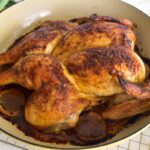 roasted chicken spatchcock style in an enameled pot