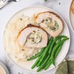 Stuffed turkey roll, mashed potatoes and green beans.