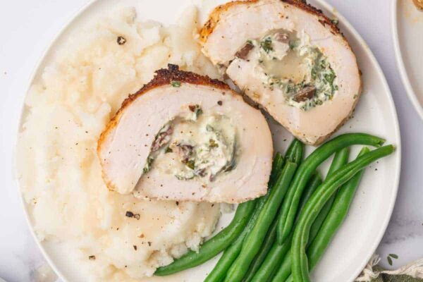 Stuffed turkey roll, mashed potatoes and green beans.
