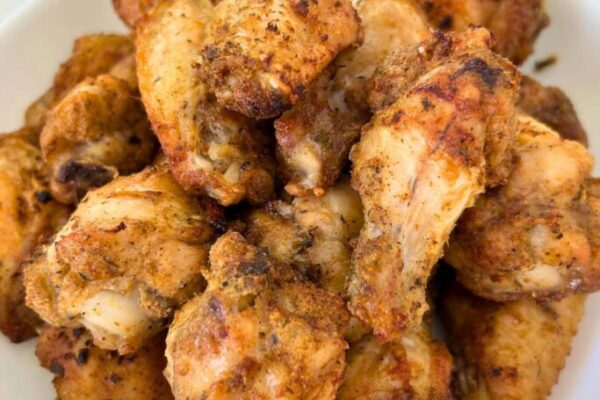 air fryer chicken wings in a white serving plate