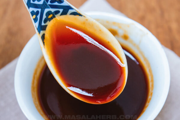 Your Go-To 3-Ingredient Stir-Fry Sauce stir fry sauce in a spoon close up