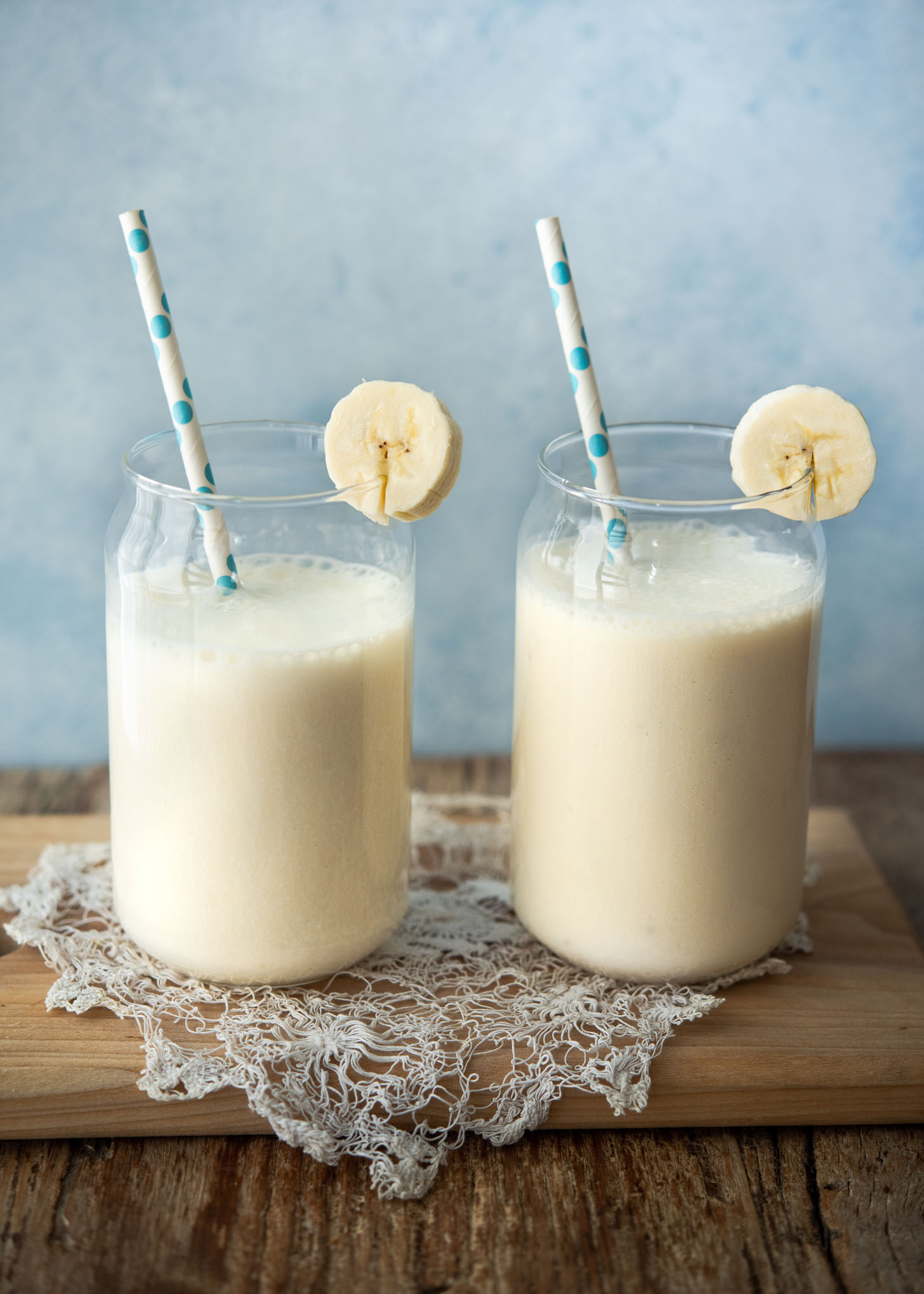 Two glasses of fresh homemade Korean banana milk on a table

