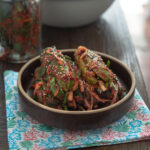 Korean stuffed cucumber kimchi served in a shallow dish