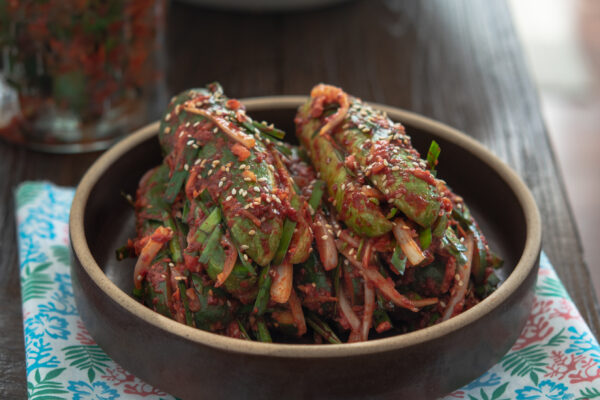 Korean stuffed cucumber kimchi served in a shallow dish