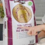 a bag of Kirkland Thai Hom Mali rice on the counter