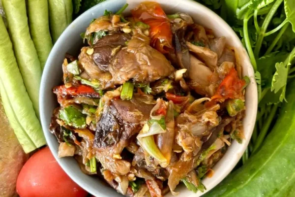 Jeow het, a Lao mushroom dipping sauce, with fresh vegetables and mackerel fish.