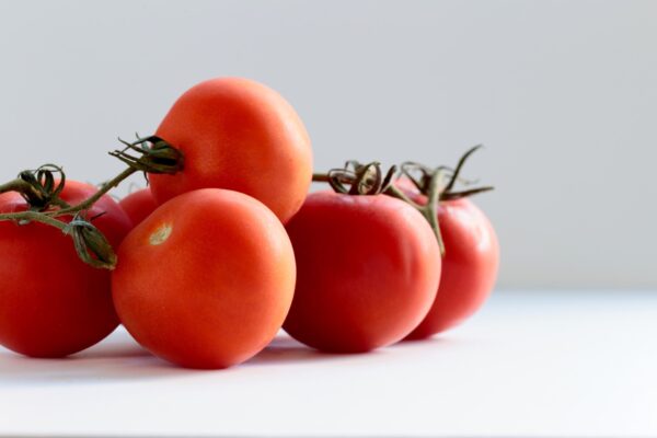 Are Tomatoes Keto? Tomatoes On A Keto Diet: Tips, Recipes, And Substitutes tomatoes lying on a table