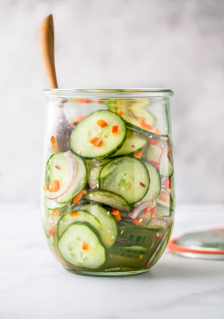 10-Minute Asian Cucumber Salad | Joyful Healthy Eats 1 Asian cucumber salad in glass jar with wooden spoon
