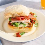 Breakfast Sandwiches with Prosciutto, Egg, Pesto, and Sun Dried Tomatoes