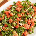 watermelon feta salad on white oval serving platter