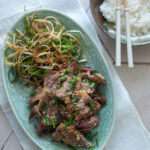 Doenjang marinated pork with green onion salad and steamed rice