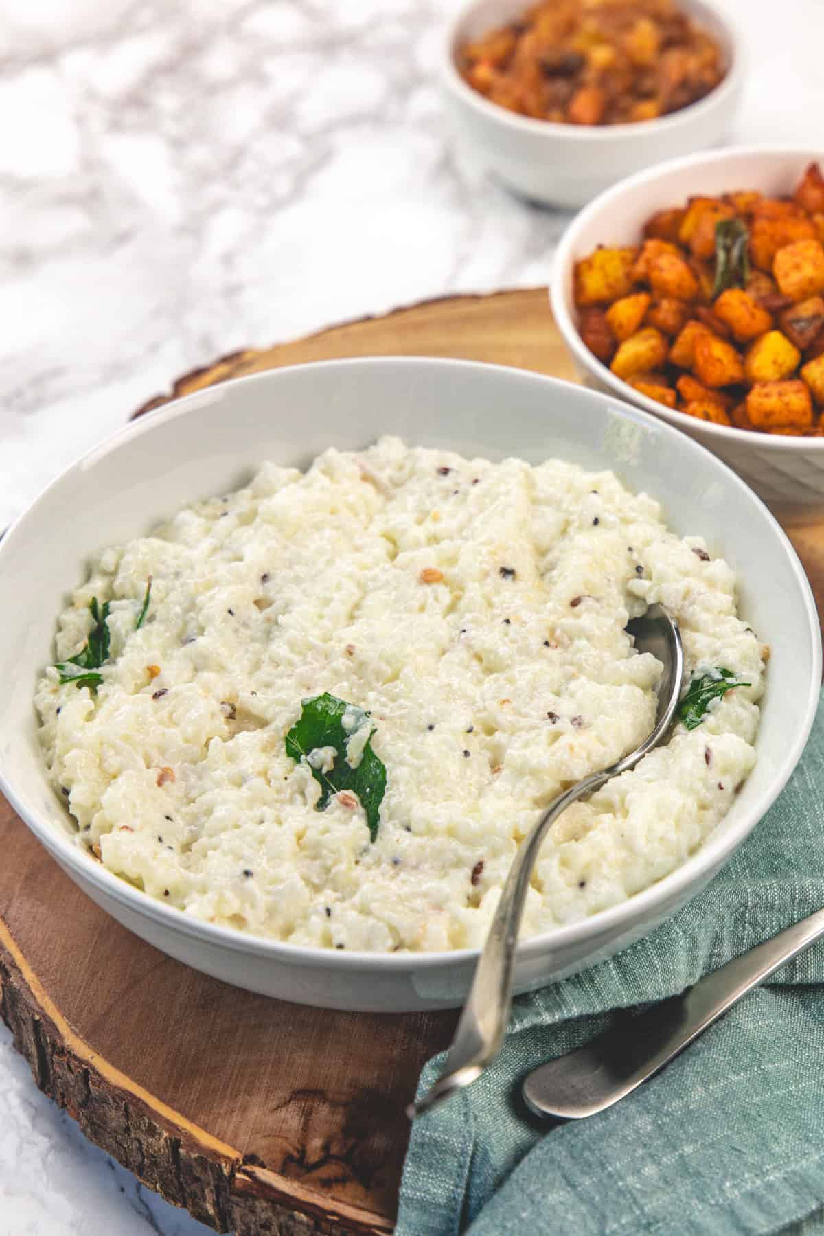 Curd Rice (Thayir Sadam, Indian Yogurt Rice) 1 Curd rice in a bowl with spoon.