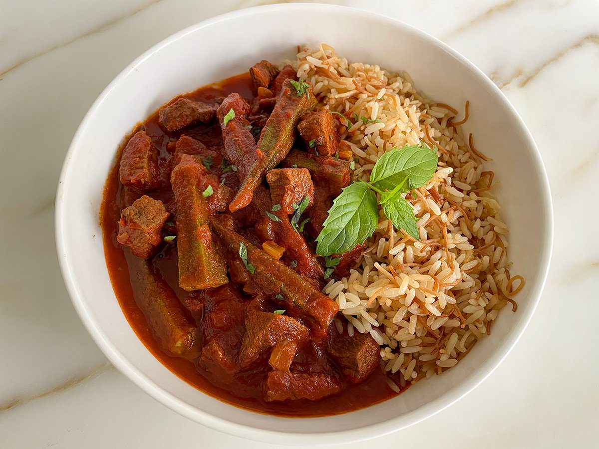Okra Stew Recipe (Simple Lebanese Bamia) 1 okra stew in a white bowl with Lebanese rice